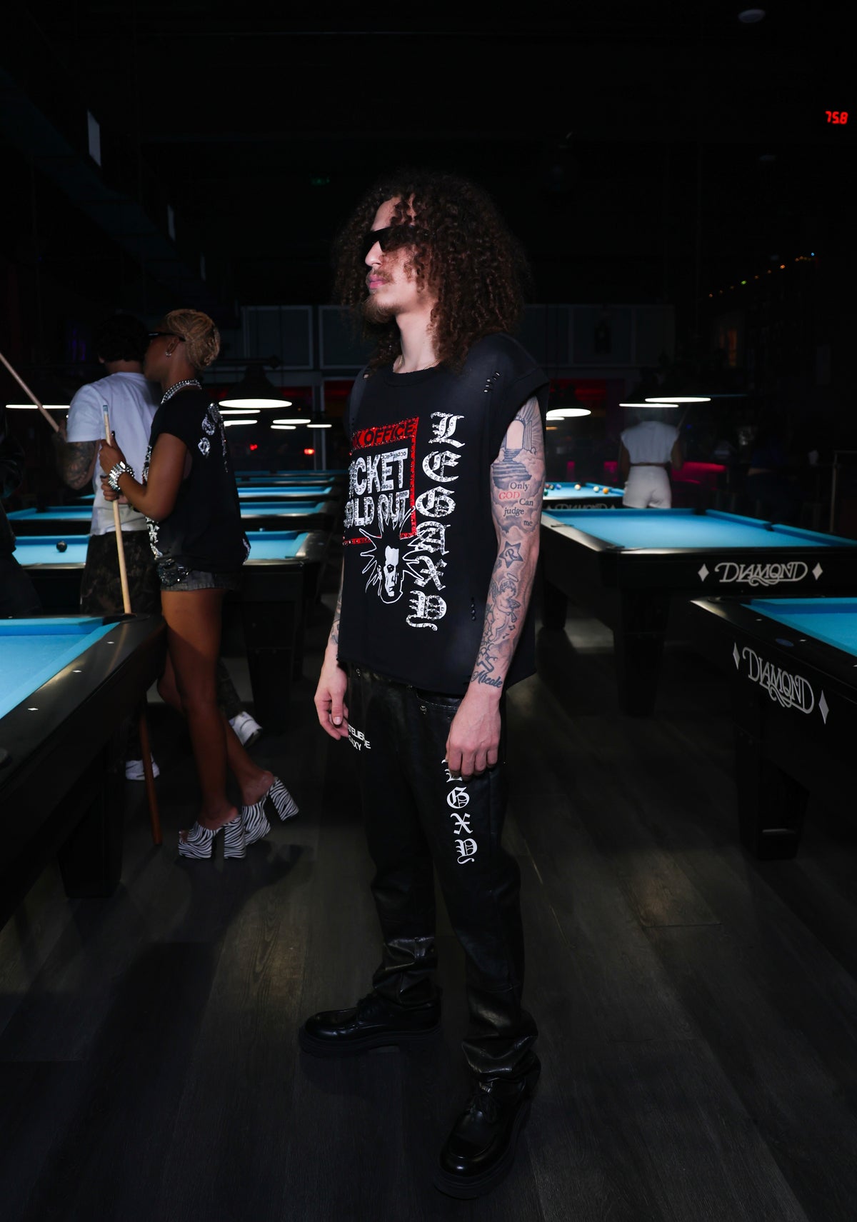 Black Mötely Crüe T-shirt by Legaxy Studios featuring a bold graphic design on front, casual fit, and soft cotton fabric.