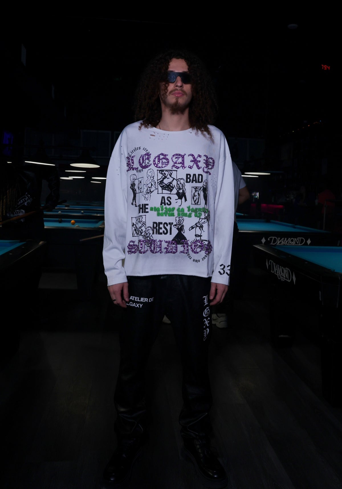Black long-sleeve T-shirt from Legaxy Studios with "As Bad As The Rest" graphic design on the front.