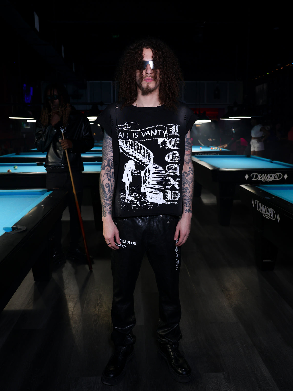 Black All Is Vanity T-shirt by Legaxy Studios, featuring a stylish graphic design on the front.