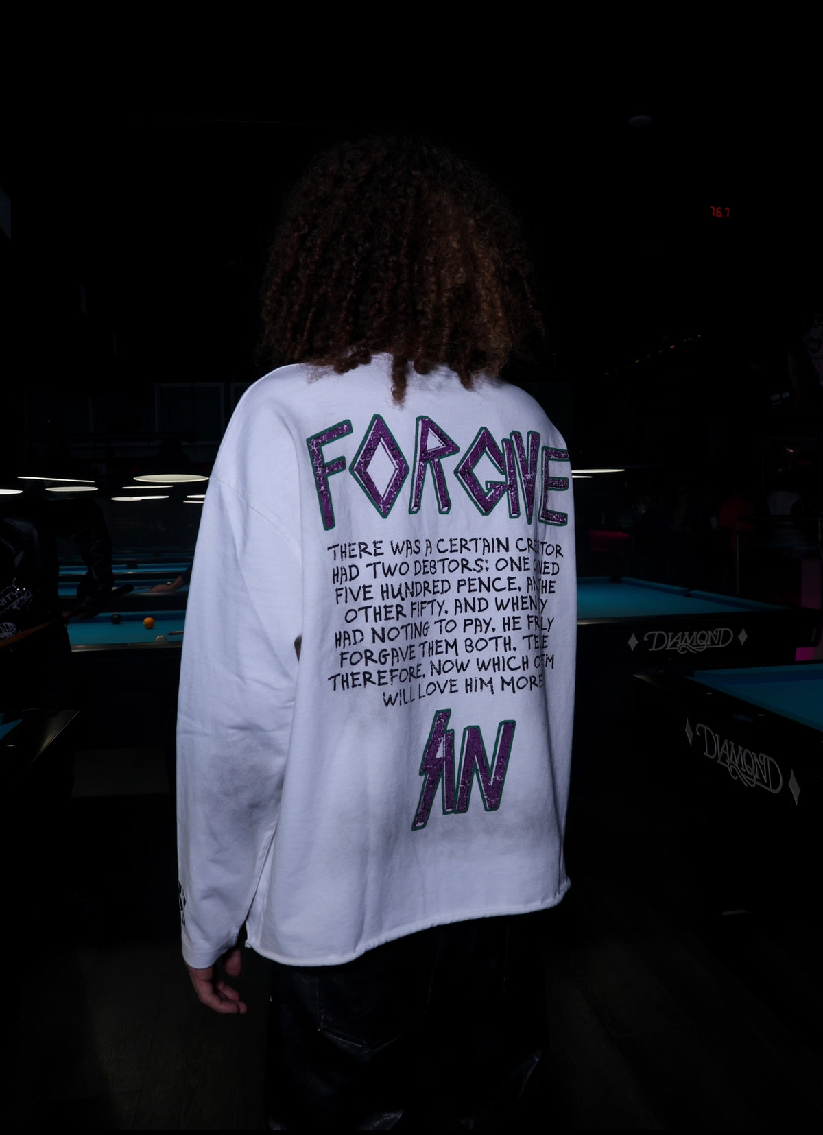 Legaxy Studios As Bad As The Rest longsleeve T-shirt with graphic design on a black fabric background.
